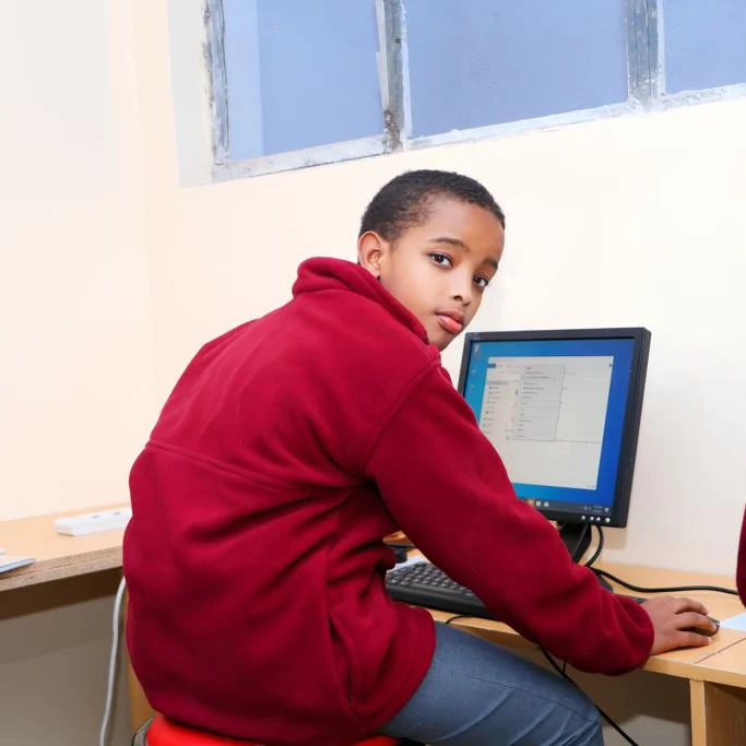 Learners raising hands in class