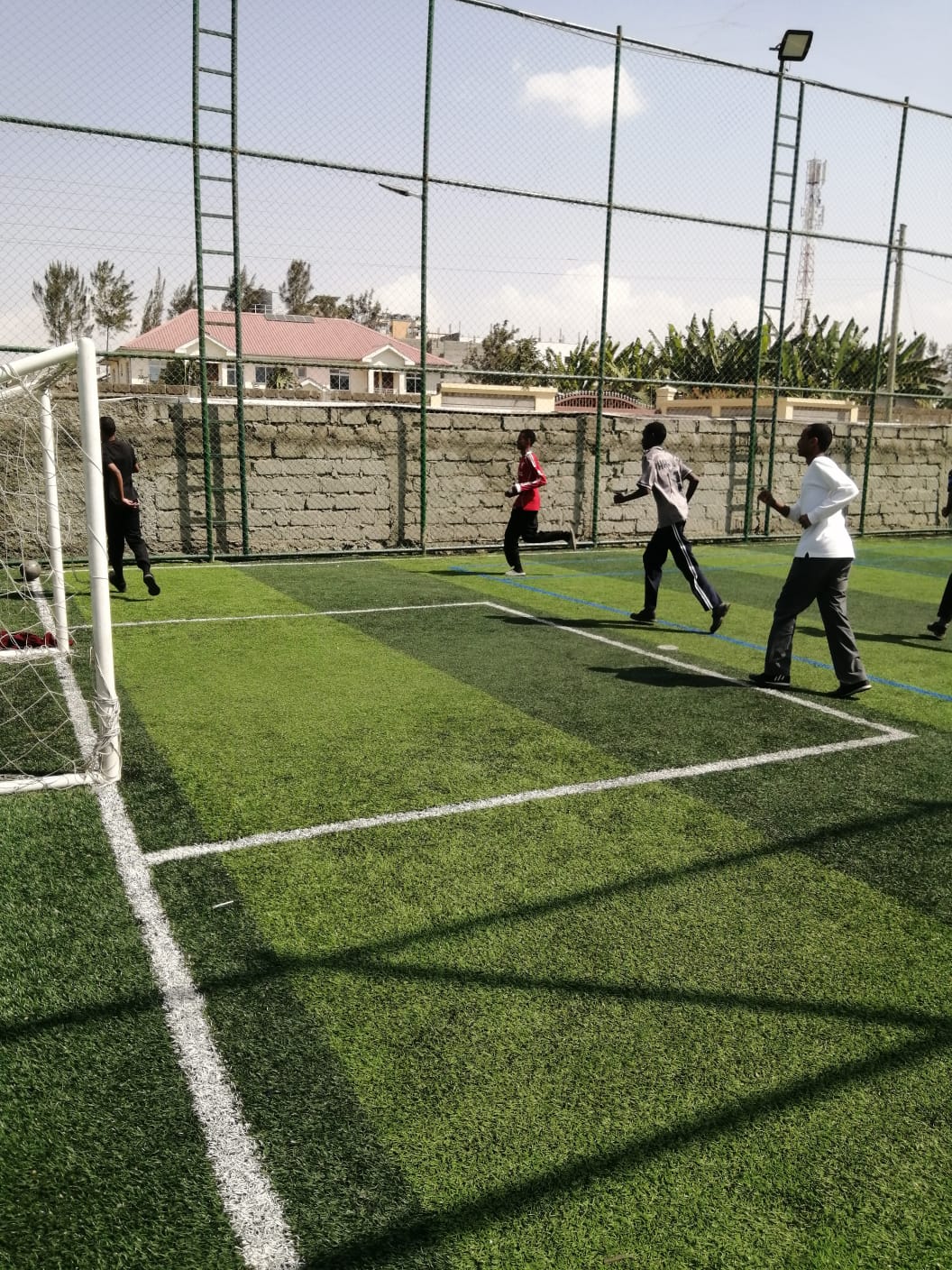 Learners running the length of the football pitch