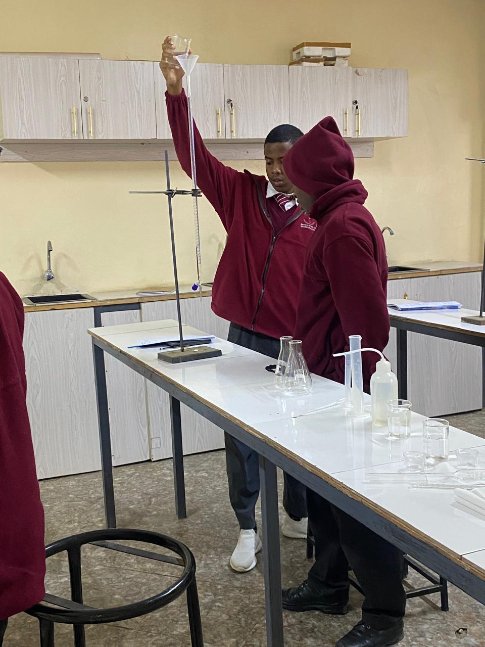 Learners filling a burette